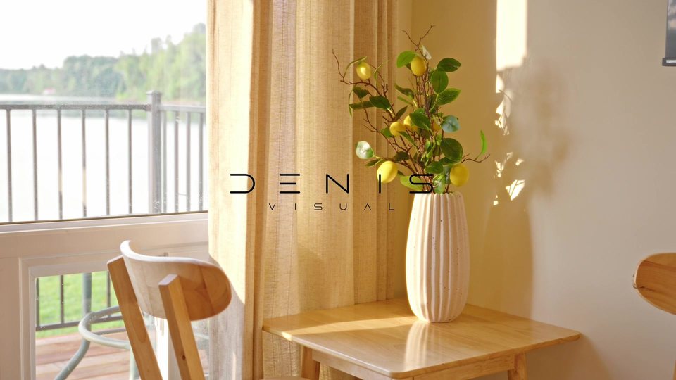 A sunlit interior with a floral arrangement, from the DENIS VISUAL property film.